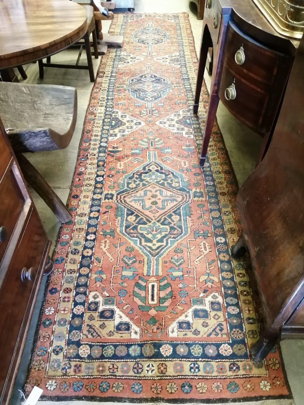 A Persian red ground runner, c.1860, 460 x 100cm